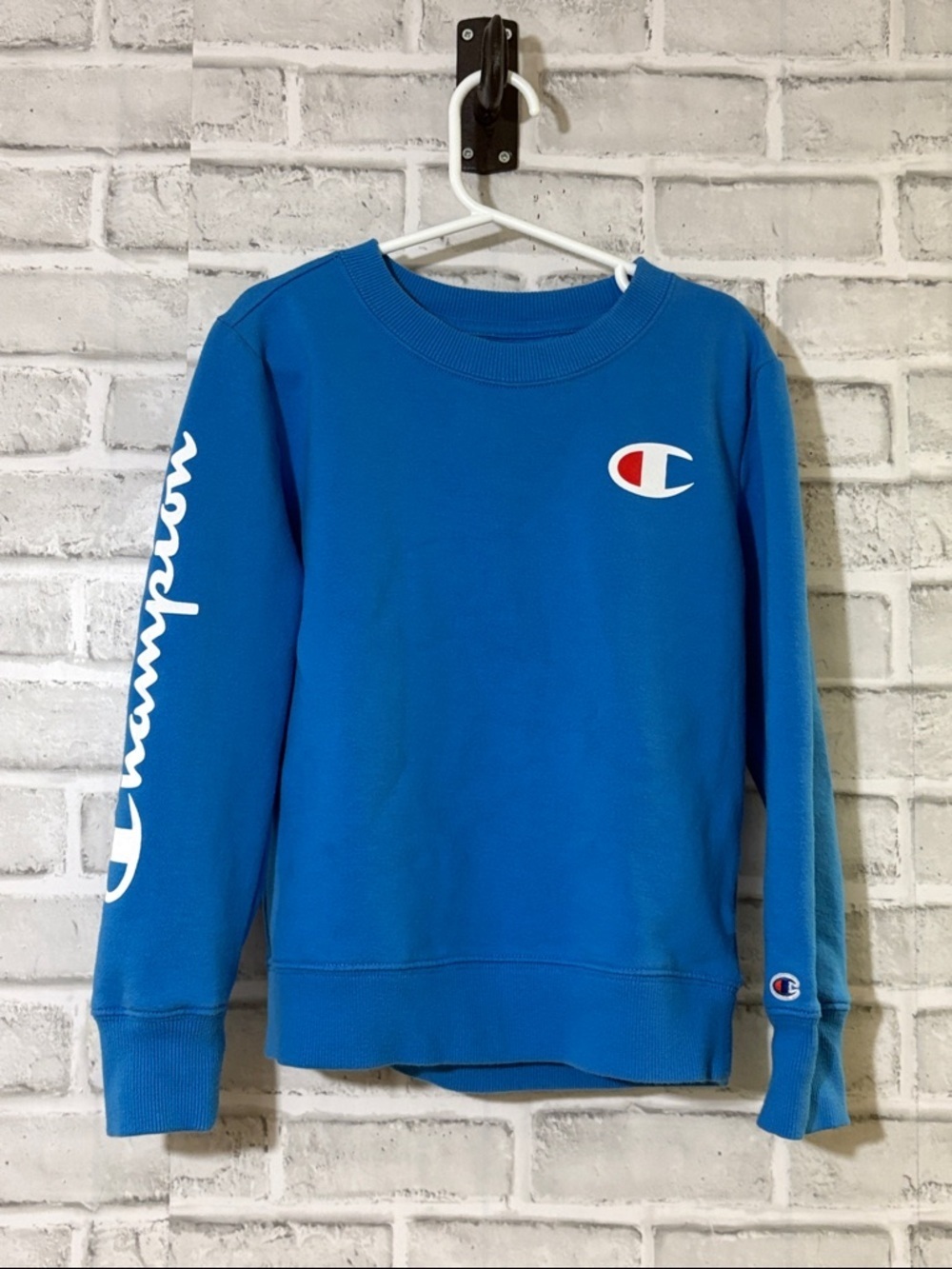 Champion Blue Crewneck Sweatshirt with White Tag and Red Accent size 6